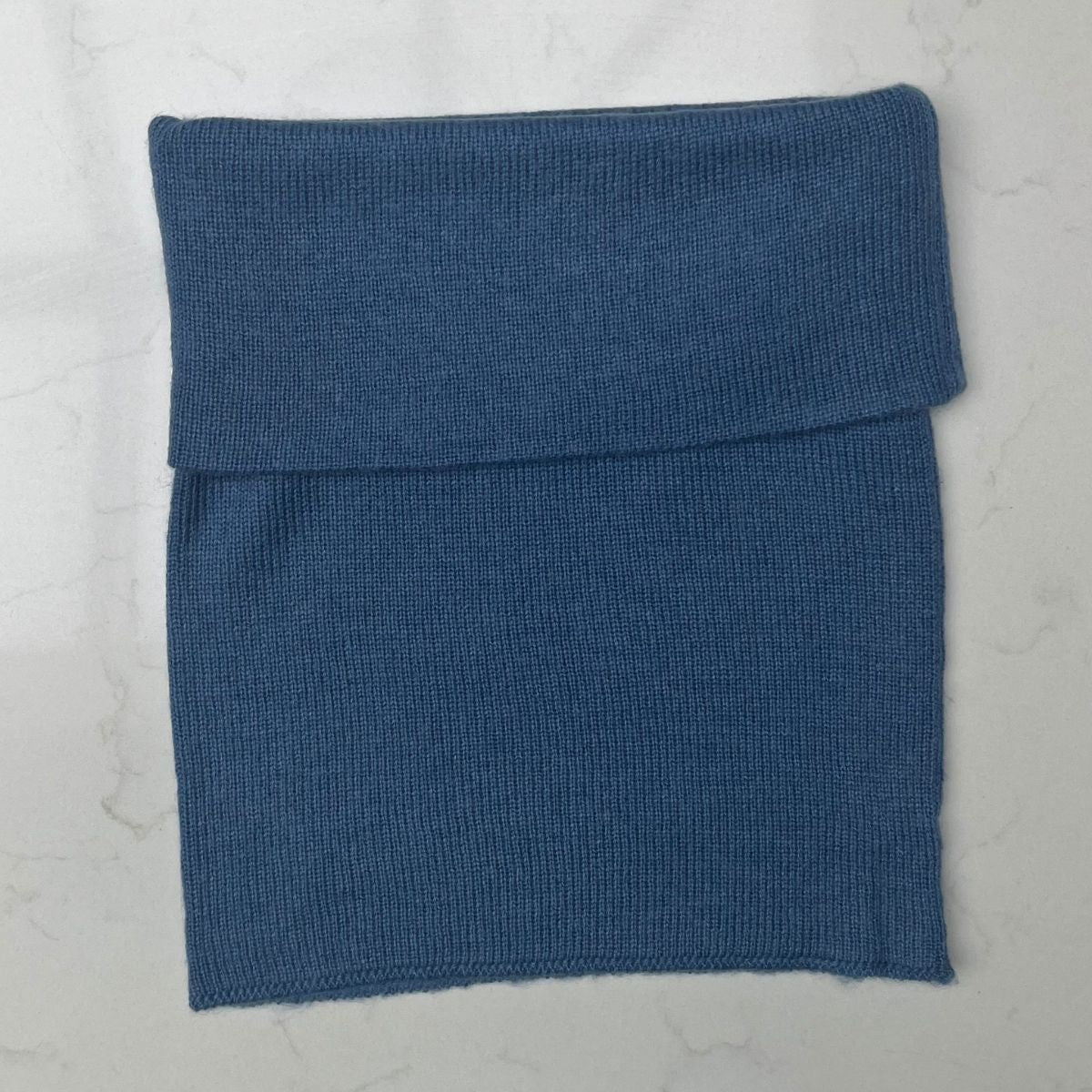 A pretty mid blue 100% cashmere Saddle Creek snood which is approx 16" long and 10" wide, perfect for keeping your neck warm in the winter out and about or on the sofa at home
