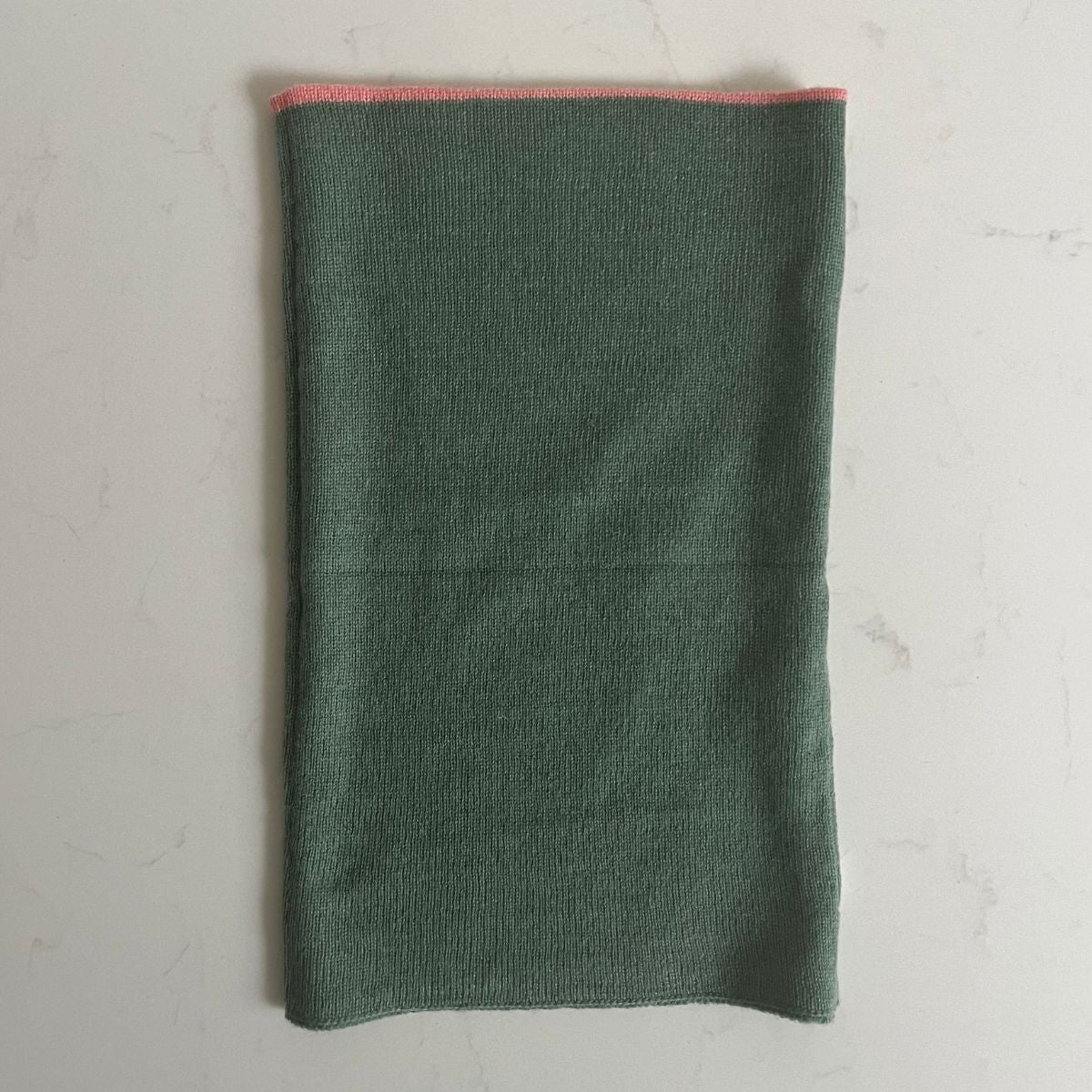 A pretty soft sea green Saddle Creek 100% cashmere snood which is reversible and approx 16" long and 10" wide. The reverse is the sea green and a corally pink in thick stripes. Can be worn either way to keep your neck cosy warm